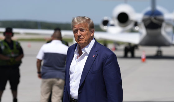 Republican presidential candidate and former President Donald Trump walks to his vehicle after arriving at the Des Moines International Airport before his visit to the Iowa State Fair in Des Moines on Saturday.
