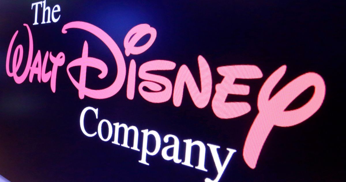 The Walt Disney Co. logo appears on a screen above the floor of the New York Stock Exchange on Aug. 7, 2017. Disney reported narrower losses and boosted revenues on its Disney+ streaming platform in the quarter that ended on July 1, but also shed Disney+ subscribers for the second quarter in a row.