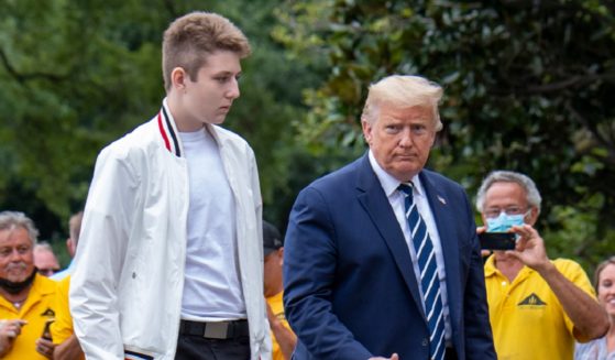 Then-President Donald Trump and his youngest son, Barron, are pictured in an August 2020 file photo outside the White House.