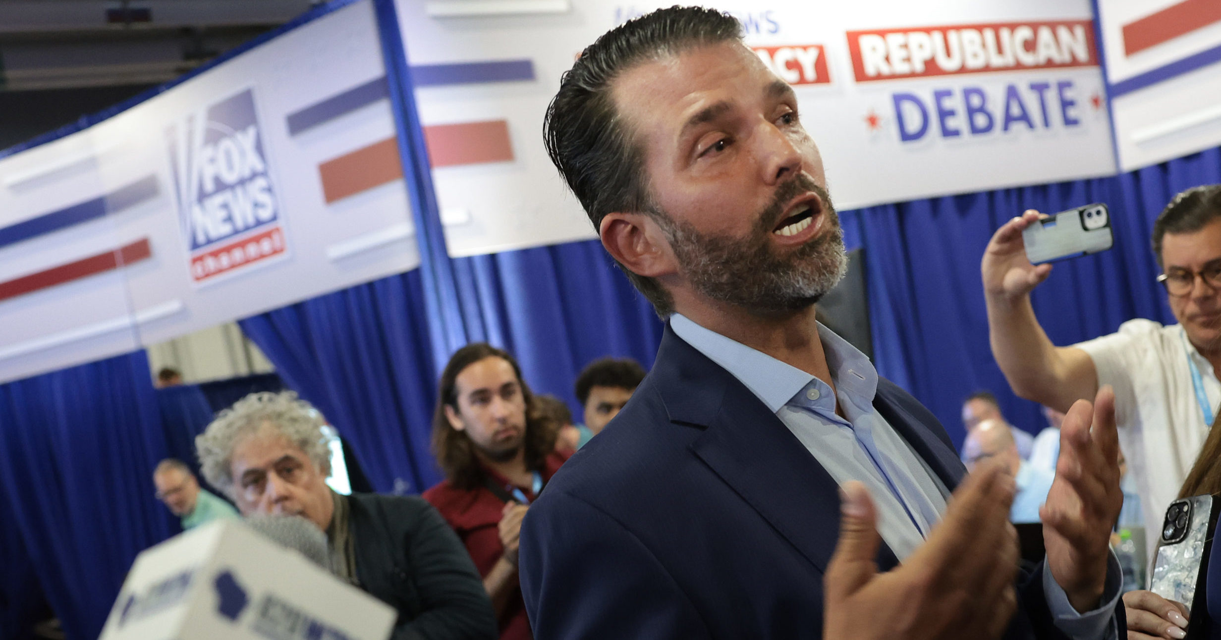 Donald Trump Jr., the eldest son of former President Donald Trump, talks to members of the media following the first debate of the GOP primary race at the Fiserv Forum in Milwaukee, on Wednesday.
