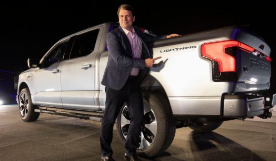 Jim Farley, CEO of Ford Motor Company, poses with the new all-electric F-150 Lightning performance truck at its reveal at Ford World Headquarters on May 19, 2021, in Dearborn, Michigan. Recently, Farley went on a road trip and realized the struggles everyday EV drivers must endure.
