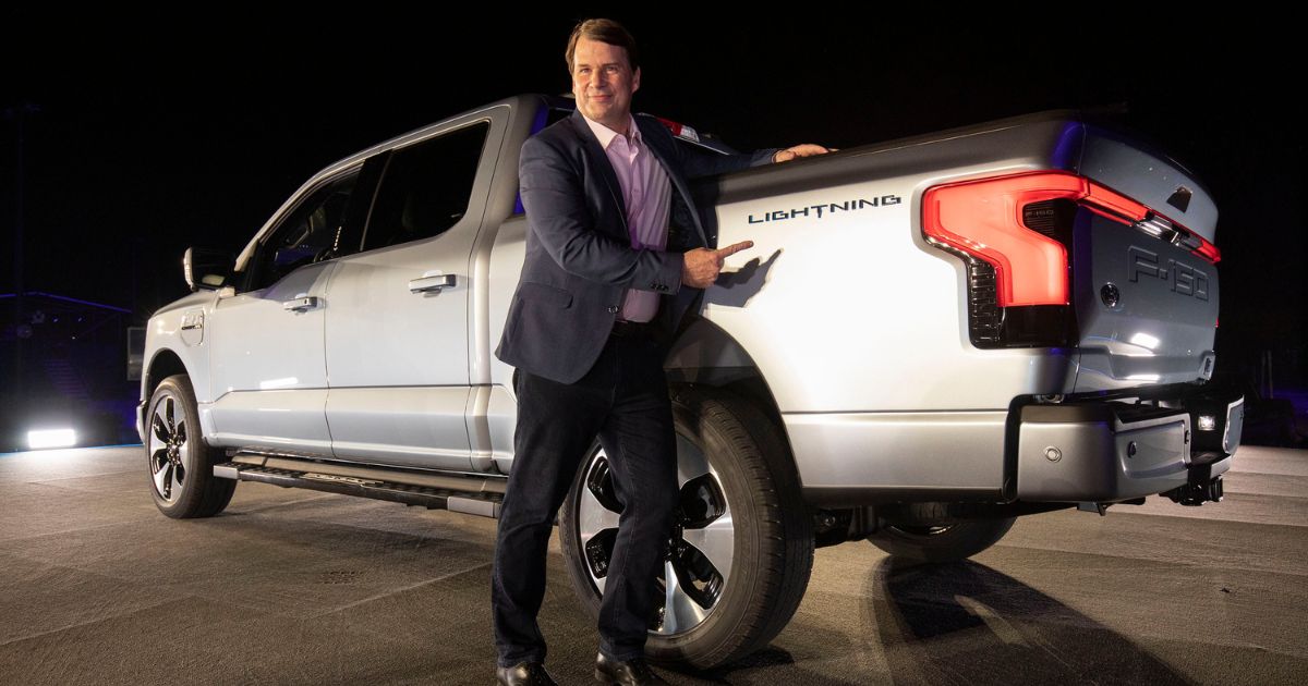 Jim Farley, CEO of Ford Motor Company, poses with the new all-electric F-150 Lightning performance truck at its reveal at Ford World Headquarters on May 19, 2021, in Dearborn, Michigan. Recently, Farley went on a road trip and realized the struggles everyday EV drivers must endure.