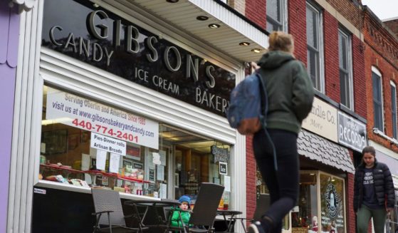 In this Nov. 22, 2017 file photo, pedestrians pass the storefront of Gibson's Bakery in Oberlin, Ohio.