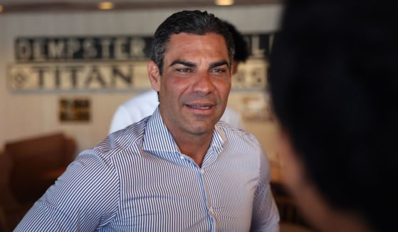 Then-Republican presidential contender and current Miami Mayor Francis Suarez greets people at the Machine Shed restaurant before having breakfast with his family and members of his campaign staff on July 29, in Urbandale, Iowa.