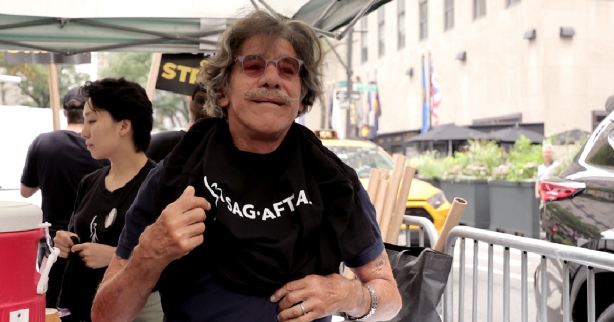 Former Fox News host Geraldo Rivera puts on a T-shirt in July while preparing the join a picket line of striking writers, actors and other media professionals in the SAG and AFTRA unions.