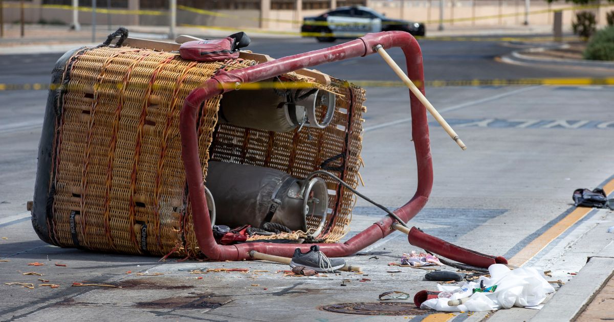 The basket of a hot air balloon lies on the pavement after a crash landing in Albuquerque, New Mexico, on June 26, 2021.