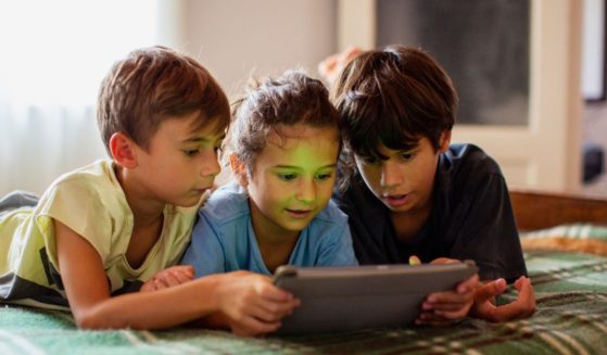 Nowadays, kids like the ones pictured have easy access to the internet, which has more negatives than positives. Recently, the Biden administration cut funding for a task force dedicated to protecting kids on the web.