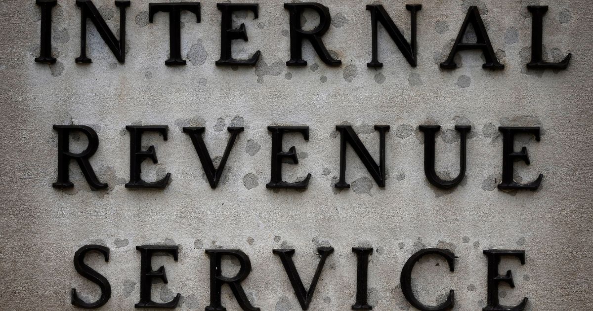 A small sign indicates the headquarters of the Internal Revenue Service on April 7, 2023 in Washington, DC.