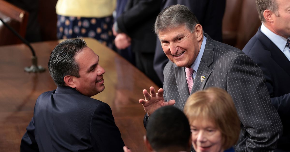 Democratic Sen. Joe Manchin of West Virginia, right, and Democratic Rep. Pete Aguilar of California talk as they wait for an address from Israeli President Isaac Herzog during a joint meeting of Congress at the U.S. Capitol in Washington on July 19.