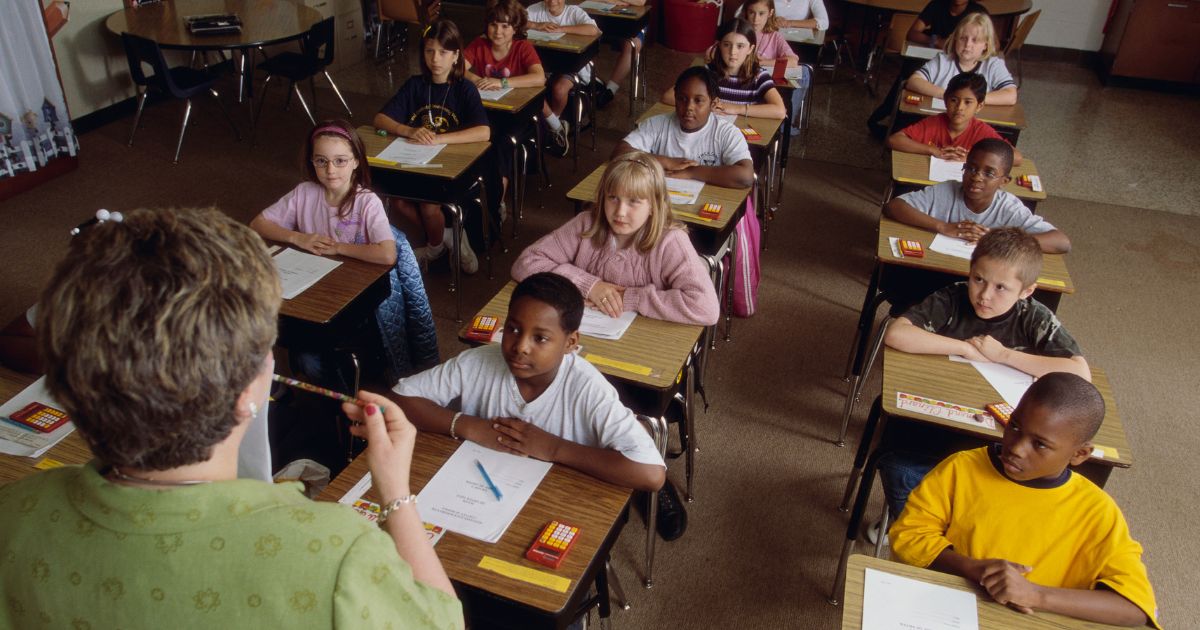 The above stock image is of students in a classroom.
