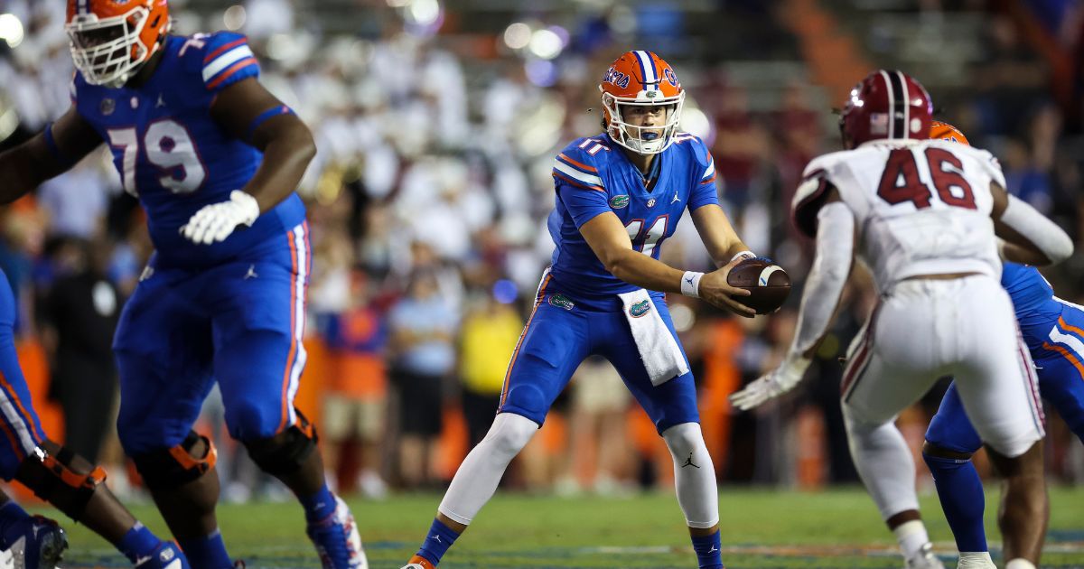 Jalen Kitna of the Florida Gators, center, hands the ball off during the second half of a game against the South Carolina Gamecocks at Ben Hill Griffin Stadium Gainesville, Florida, on Nov. 12.