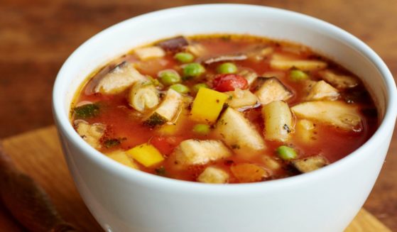 A simple bowl of minestrone, as pictured, had an unpleasant surprise for an Olive Garden customer. However, the restaurant is refuting his claims, potentially stirring the pot for a big legal battle.