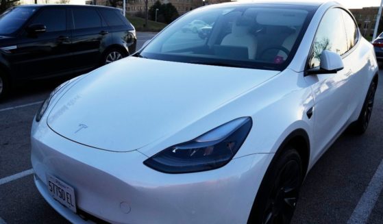 A Tesla Model Y electric vehicle is parked at a shopping plaza in Des Plaines, Illinois, on Dec. 3, 2022.