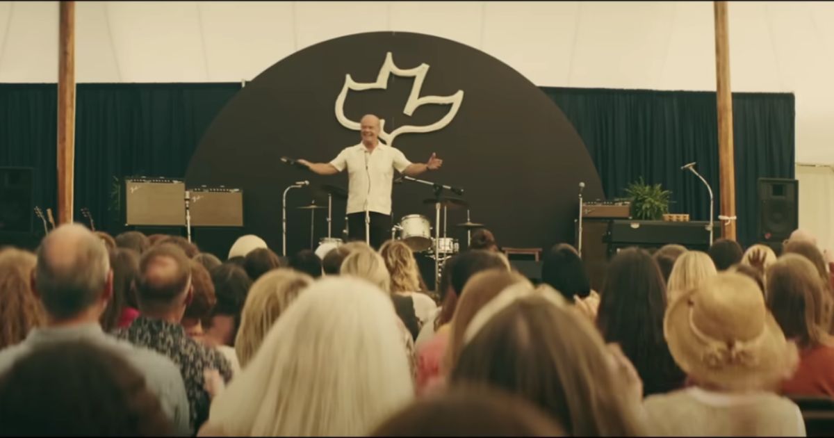In this frame of "Jesus Revolution," actor Kelsey Grammer, who plays Pastor Chuck Smith, is seen preaching.