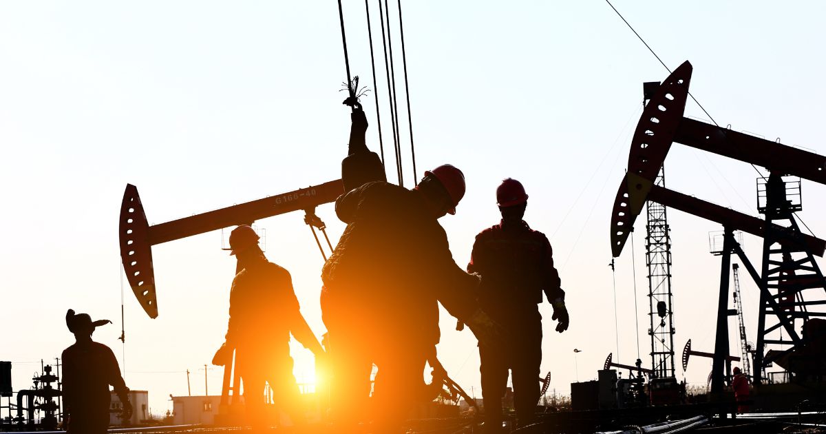 Oil field workers are seen in this stock image.