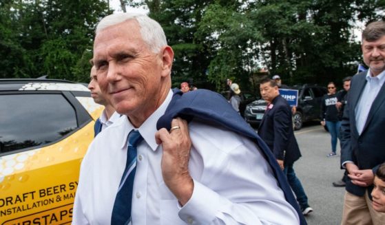 Presidential hopeful and former Vice President Mike Pence arrives at a campaign event at American Legion Hall Post 27 in Londonderry, New Hampshire, on Friday.