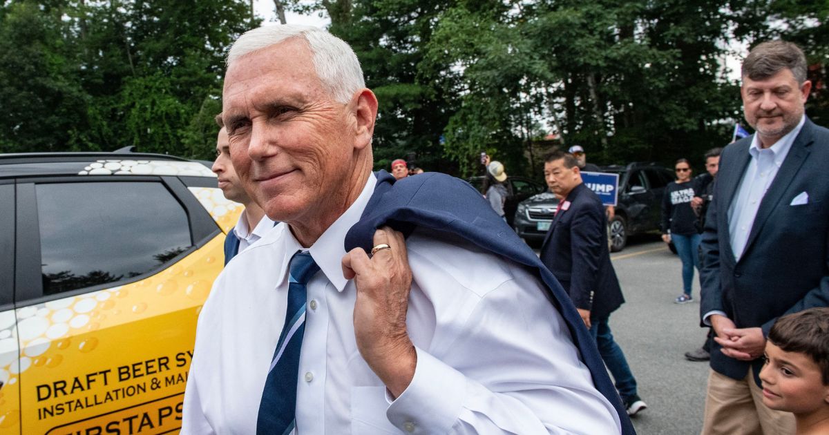 Presidential hopeful and former Vice President Mike Pence arrives at a campaign event at American Legion Hall Post 27 in Londonderry, New Hampshire, on Friday.