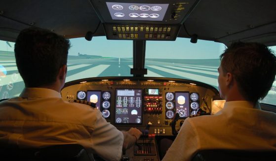 The above stock image is of pilots in a plane.