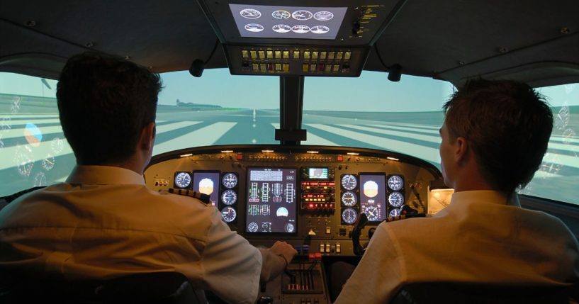 The above stock image is of pilots in a plane.