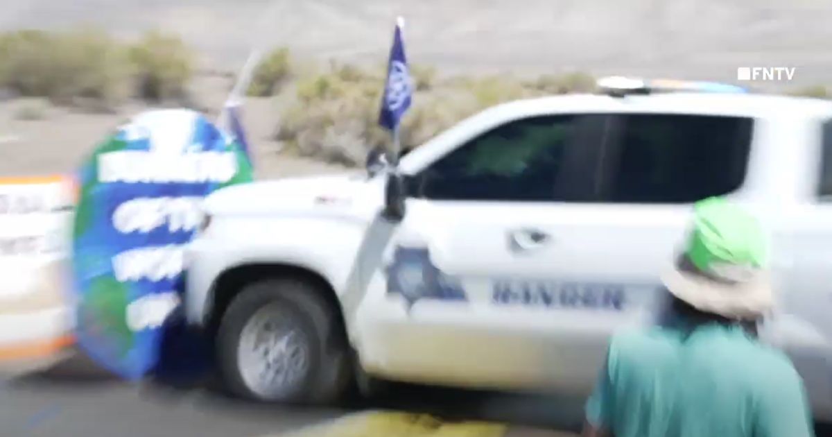 A tribal police vehicle crashes through protesters' barricade in Nevada.