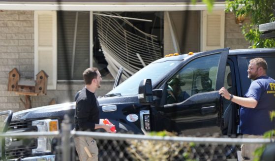 FBI process the home of Craig Robertson who was shot and killed by the FBI in a raid on his home this morning on August 9, 2023 in Provo, Utah.