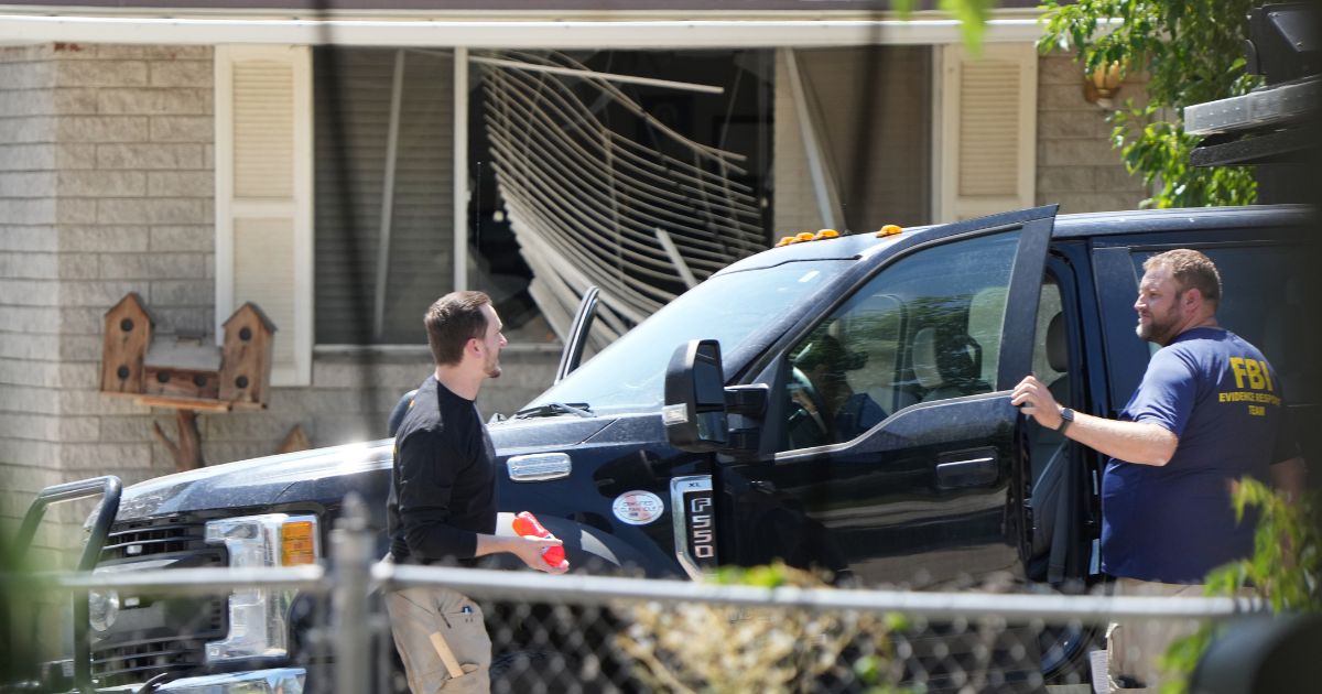 FBI process the home of Craig Robertson who was shot and killed by the FBI in a raid on his home this morning on August 9, 2023 in Provo, Utah.