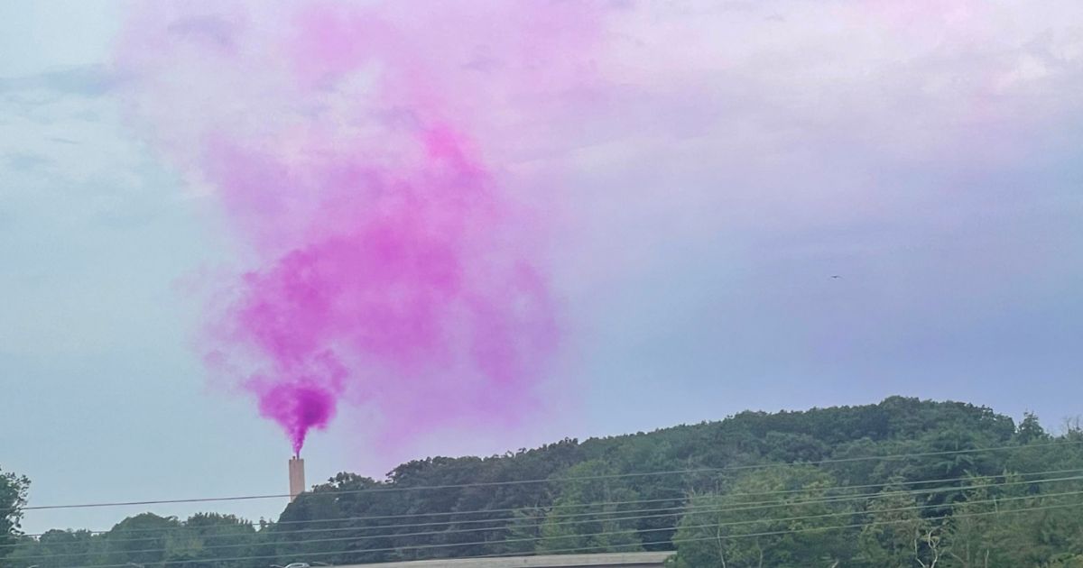 This Twitter screen shot shows the unexplained purple smoke hovering above the Ecomaine waste management facility in Portland, Maine, on Aug. 3 and 4, 2023.