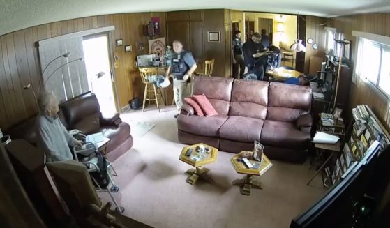 Security camera footage showed a 98-year-old woman who had her house raided by Kansas police officers.