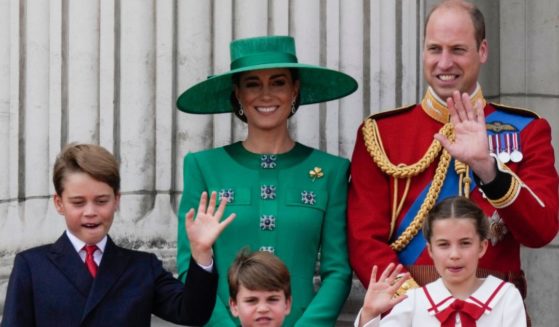 Prince William, back right, Kate, Princess of Wales, back left, Princess Charlotte, bottom right, Prince Louis, bottom center, and Prince George, bottom left, greet the crowd from the balcony of Buckingham Palace after the Trooping The Colour parade in London, on June 17.