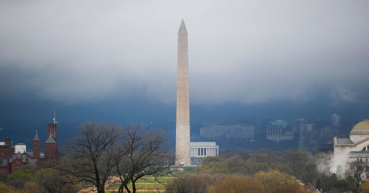 Storm clouds form around the Washington Monument and Lincoln Memorial in Washington, D.C., on April 6, 2017.