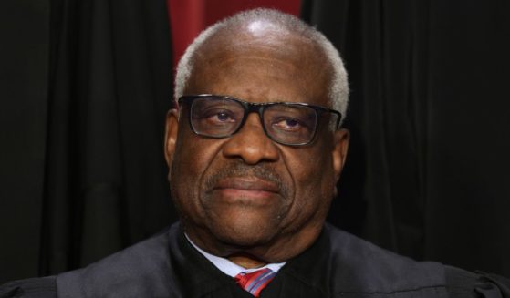 United States Supreme Court Associate Justice Clarence Thomas poses for an official portrait at the East Conference Room of the Supreme Court building on Oct. 7, 2022, in Washington, D.C. Recently, 112 of Thomas' former law clerks wrote a letter addressing his critics.
