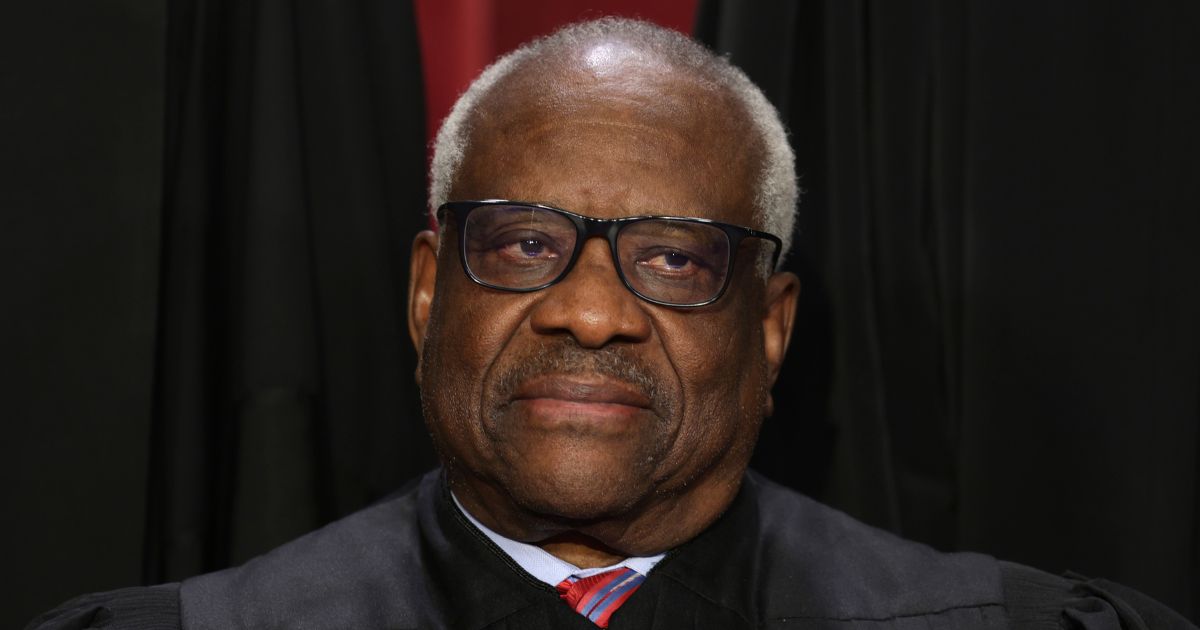 United States Supreme Court Associate Justice Clarence Thomas poses for an official portrait at the East Conference Room of the Supreme Court building on Oct. 7, 2022, in Washington, D.C. Recently, 112 of Thomas' former law clerks wrote a letter addressing his critics.
