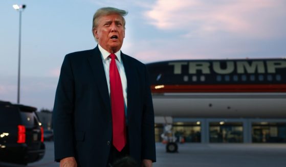 Former President Donald Trump speaks to the media at Atlanta Hartsfield-Jackson International Airport after surrendering at the Fulton County jail on Thursday in Atlanta.