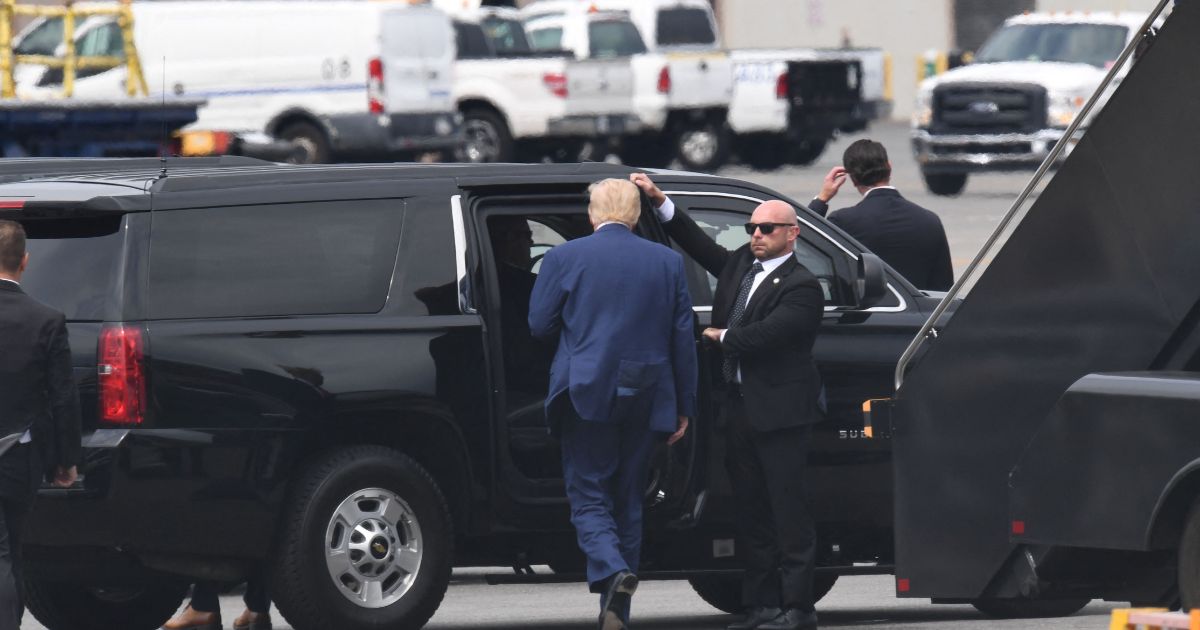 Former US President and 2024 hopeful Donald Trump disembarks his plane "Trump Force One" on arrival at Ronald Reagan Washington National Airport in Arlington, Virginia, on August 3, 2023.