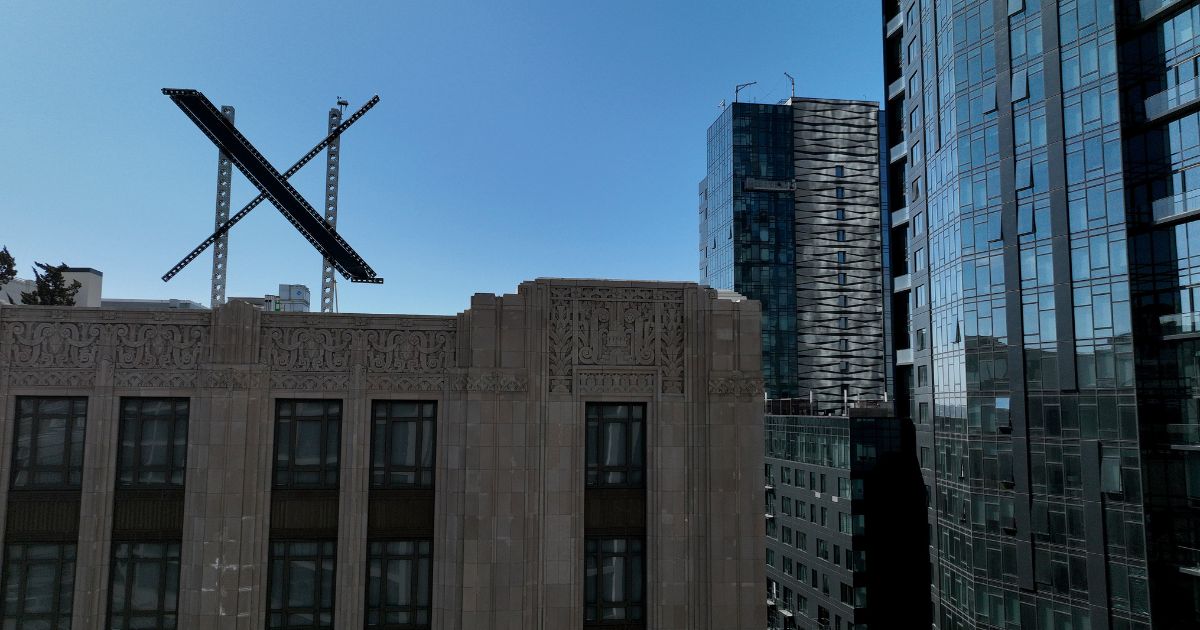 A large X logo is visible on the roof of X headquarters on Monday in San Francisco.