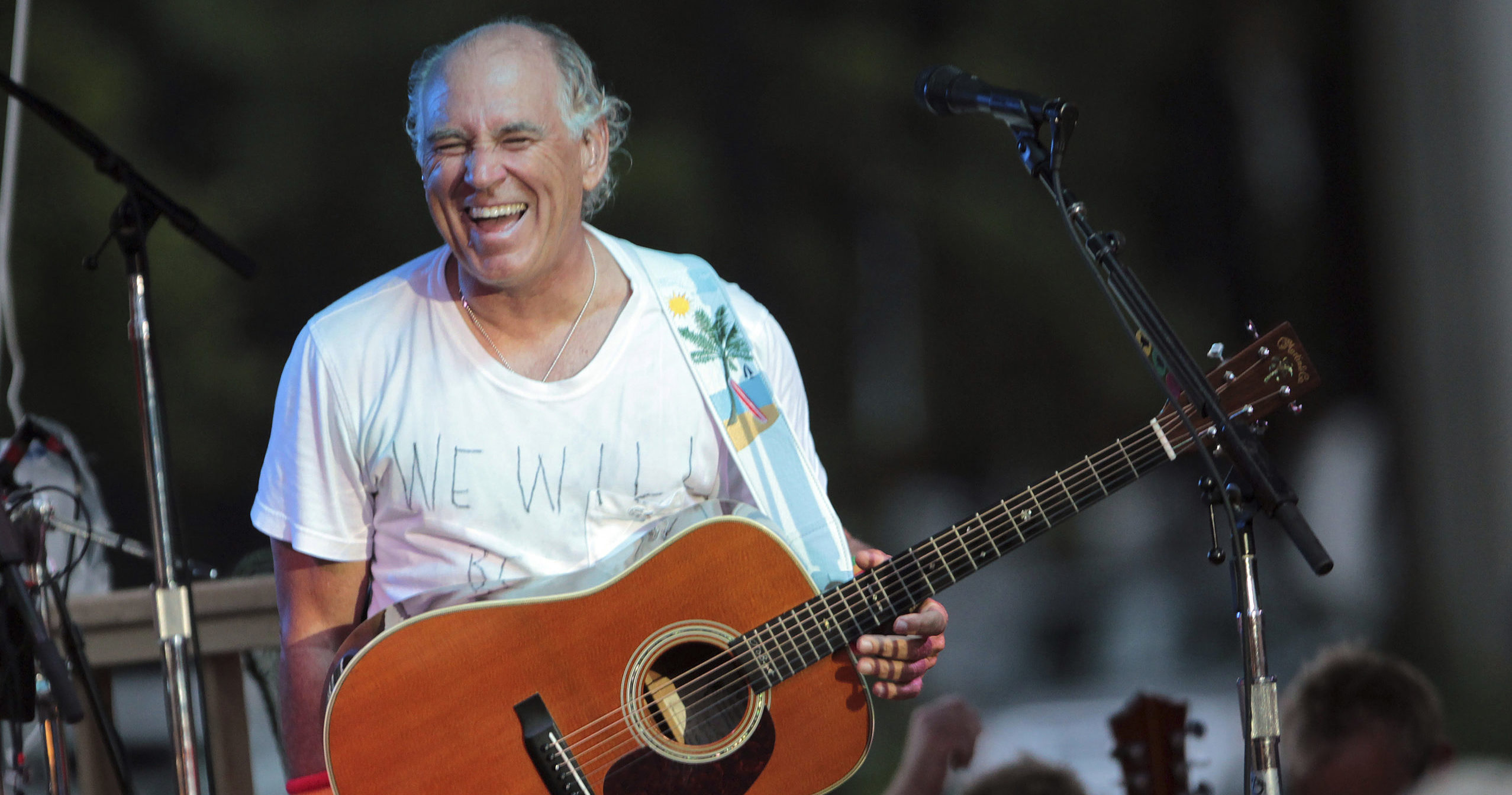 Jimmy Buffett performs at his sister's restaurant in Gulf Shores, Alabama on June 30, 2010.