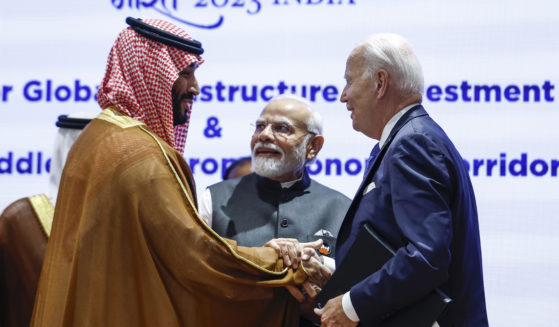 Saudi Arabian Crown Prince Mohammed bin Salman Al Saud, left, and President Joe Biden, right, shake hands next to Indian Prime Minister Narendra Modi at the G20 summit in New Delhi, India.