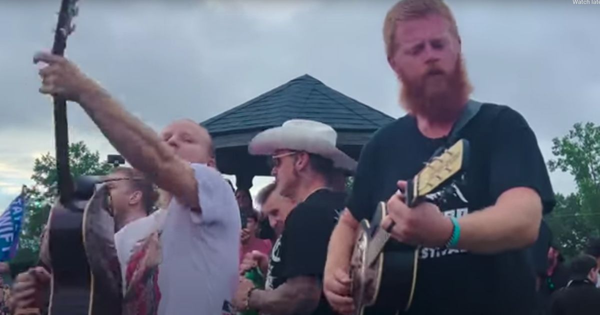 Oliver Anthony, right, joined Shinedown and Papa Roach for an impromptu acoustic concert after a Virginia music festival was cancelled due to severe weather.