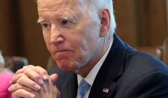 President Joe Biden listens to shouted questions regarding his impeachment during a meeting at the White House in Washington on Wednesday.