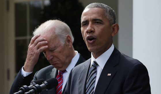 Then-Vice President Joe Biden listens as then-President Barack Obama speaks in the Rose Garden at the White House in Washington on Nov. 9, 2016.