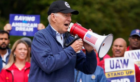 President Joe Biden joins striking United Auto Workers on the picket line, Tuesday in Van Buren Township, Michigan.