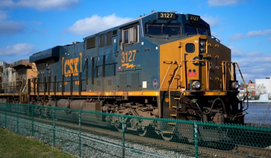 a CSX freight train sittting on a siding