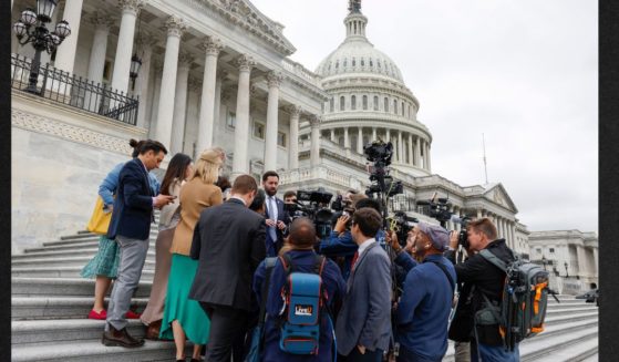 GOP Rep. Mike Lawler of New York speaks to reporters outside of the U.S. Capitol Building Friday in Washington, D.C. as the House of Representatives negotiated a temporary funding bill to avert a government shutdown.