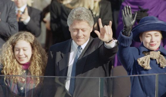President Bill Clinton, his daughter Chelsea, left, and wife Hillary Rodham Clinton, right, wave to the crowd on inauguration day, Jan. 20, 1993, in Washington.