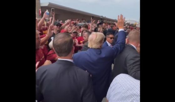 Former President Donald Trump arrives at Jack Trice Stadium for a football game between the University of Iowa and Iowa State University on Saturday.