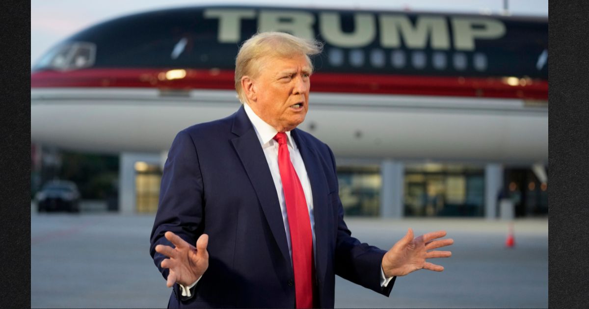 Former President Donald Trump is seen speaking with reporters before departure from Hartsfield-Jackson Atlanta International Airport in a file photo from Aug. 24, 2023.