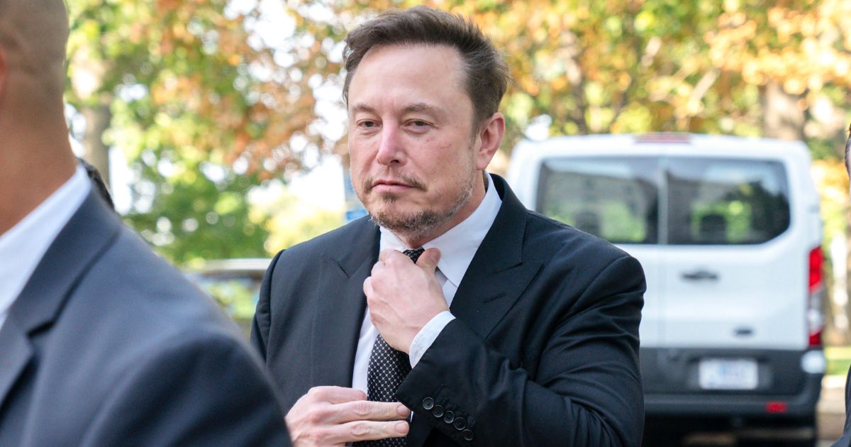 Elon Musk tightening his tie