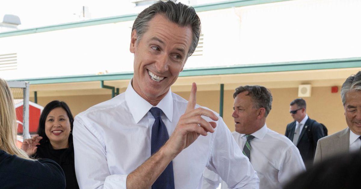 California Gov. Gavin Newsom talks with students at River City High School in West Sacramento, California, on Aug. 31. In an interview airing Sunday, Newsom will address speculation that he will run for president in 2024.