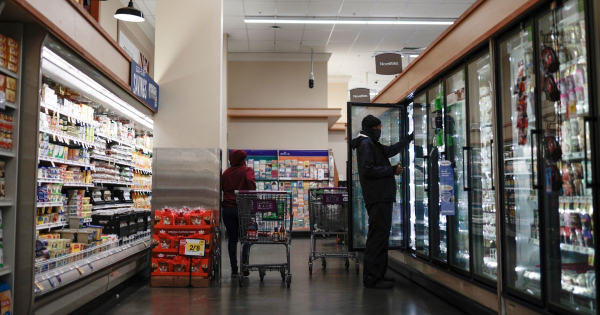 Customers shop at a Giant Food supermarket in Washington, D.C., on Nov. 22, 2021.