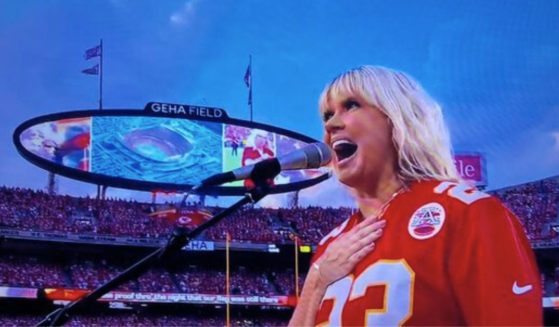 Christian artist Natalie Grant sings the national anthem before the NFL's season opener Thursday at Arrowhead Stadium in Kansas City.